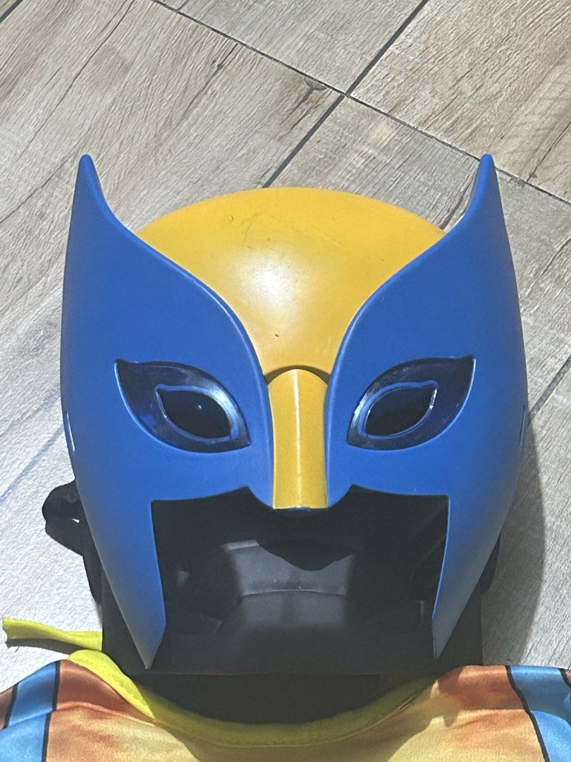 Wolverine Kids Costume with Mask (Category: Babies & Kids Fashion) located in Paranaque City. Submitted by zac.sei (Listing ID 1469395084, Image 2). Description: - Kids Wolverine costume - Includes full jumpsuit with printed muscle padding - Matching blue and yellow plastic mask with eye holes - Vibrant blue and yellow design - Perfect for Halloween, dress-up parties, and cosplay - Clean fabric, ready to wear.