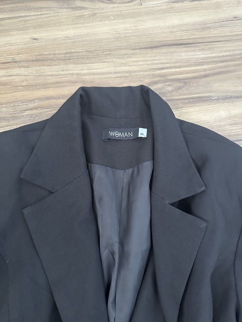 Woman Black Single Button Blazer Size XS (Category: Coats, Jackets and Outerwear) located in Paranaque City. Submitted by declutterwyae (Listing ID 1469404063, Image 2). Description: - Brand: Woman - Size: XS - Color: Black - Closure: Single front button - Details: Structured lapel collar, two side flap pockets, fully lined - Style: Perfect for office wear or smart casual outfits.