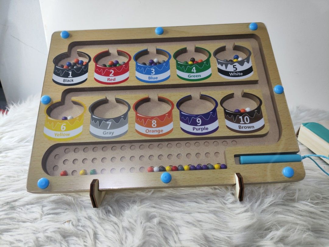Wooden Color Classification Maze Sorting Board Toy (Category: Educational & Learning Toys) located in Cavite. Submitted by tinetaclesss (Listing ID 1469498051, Image 3). Description: - Suitable for toddlers aged 36 months and up - Features a wooden color classification maze with an attached magnetic pen - Includes wooden stand supports and original box packaging - Promotes fine motor skills, color recognition, and sorting practice - Safe design w