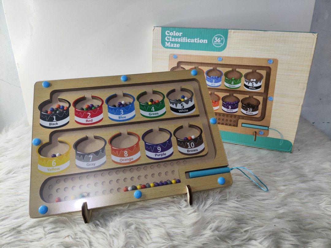 Wooden Color Classification Maze Sorting Board Toy (Category: Educational & Learning Toys) located in Cavite. Submitted by tinetaclesss (Listing ID 1469498051, Image 2). Description: - Suitable for toddlers aged 36 months and up - Features a wooden color classification maze with an attached magnetic pen - Includes wooden stand supports and original box packaging - Promotes fine motor skills, color recognition, and sorting practice - Safe design w