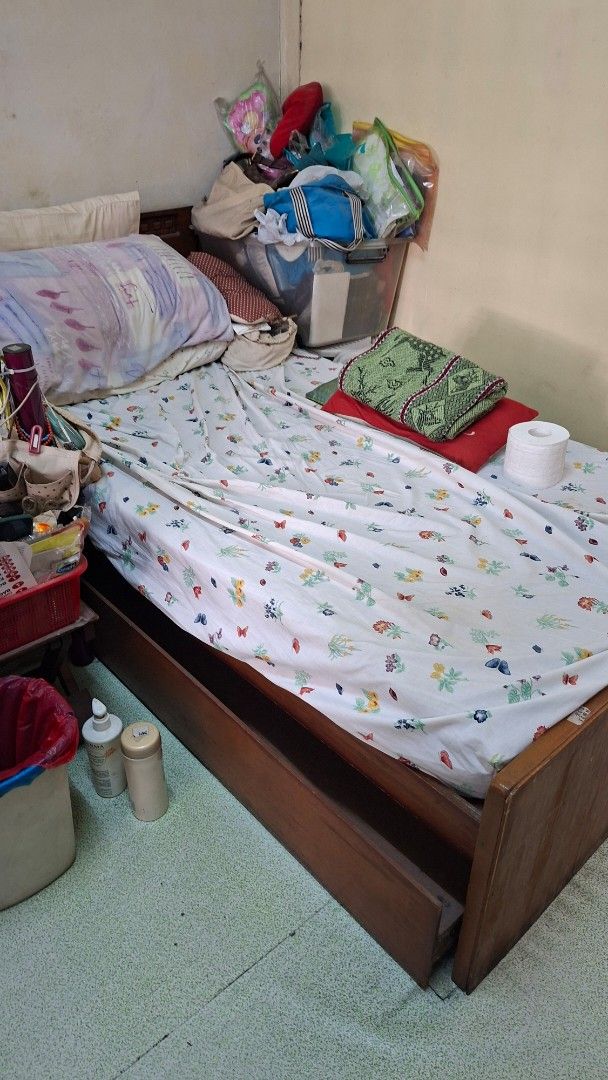 Wooden single bed frame with pull out (Category: Bed Frames & Mattresses) located in Manila. Submitted by daisythejane (Listing ID 1469537341, Image 2). Description: ❗️available by mid dec 2026 pa ❗️ - Type: Wooden single bed frame with pull out bed - Features: Solid wooden headboard and durable side panels - Size: Standard single, perfect for small bedrooms or guest rooms - Can include mattress but warning very old already size: 77in length 38.5