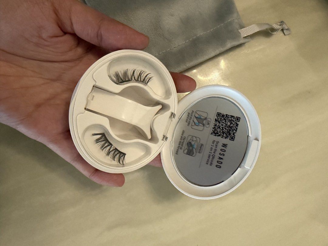 Wosado Magnetic Eyelashes Set with Case and Pouch (Category: Makeup) located in Manila. Submitted by deniellegilbuena (Listing ID 1469442169, Image 2). Description: - Authentic Wosado magnetic eyelashes - Includes a sleek white compact case and applicator tool - Comes with a soft grey branded drawstring pouch - Glue-free application for quick and mess-free use - Reusable design and kept in excellent, clean condition.