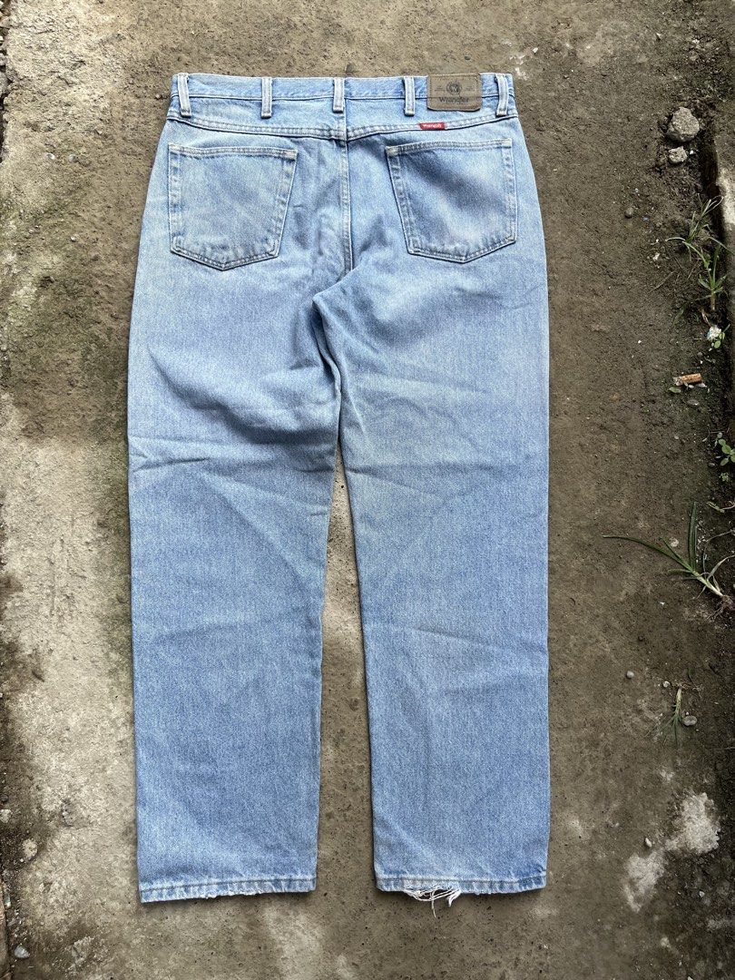 Wrangler Light Wash Denim Jeans (Category: Jeans) located in Manila. Submitted by thrifttika (Listing ID 1469446521, Image 3). Description: - Brand: Wrangler - Style: Straight leg, five-pocket design with button/zip fly - Wash: Light wash denim with back leather patch - Size: Tagged 35 x 30 (Made in Mexico) - Material: 100% cotton - Condition: Minor fraying at the hem openings from normal wear.