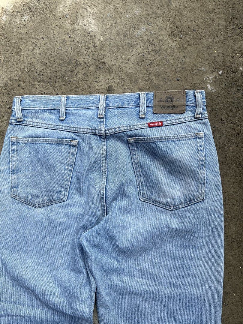 Wrangler Light Wash Denim Jeans (Category: Jeans) located in Manila. Submitted by thrifttika (Listing ID 1469446521, Image 1). Description: - Brand: Wrangler - Style: Straight leg, five-pocket design with button/zip fly - Wash: Light wash denim with back leather patch - Size: Tagged 35 x 30 (Made in Mexico) - Material: 100% cotton - Condition: Minor fraying at the hem openings from normal wear.