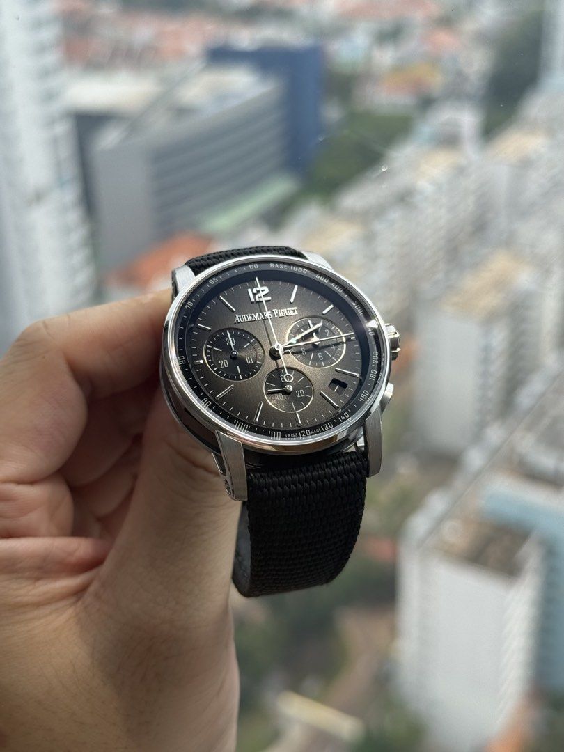 WTS LNIB Audemars Piguet AP Code 11.59 Chronograph 26393NB.OO.A002KB.01 White Gold Ceramic Smoked Grey Full Set (Category: Watches) located in Singapore. Submitted by dennisrodman1969 (Listing ID 1469551440, Image 1). Description: - Brand: Audemars Piguet Code 11.59 Chronograph Flyback - Dial: Black textured with Arabic numeral 12 and sub-dials - Movement: Swiss-made self-winding - Straps: Black textured strap + two extra m straps included - Acce