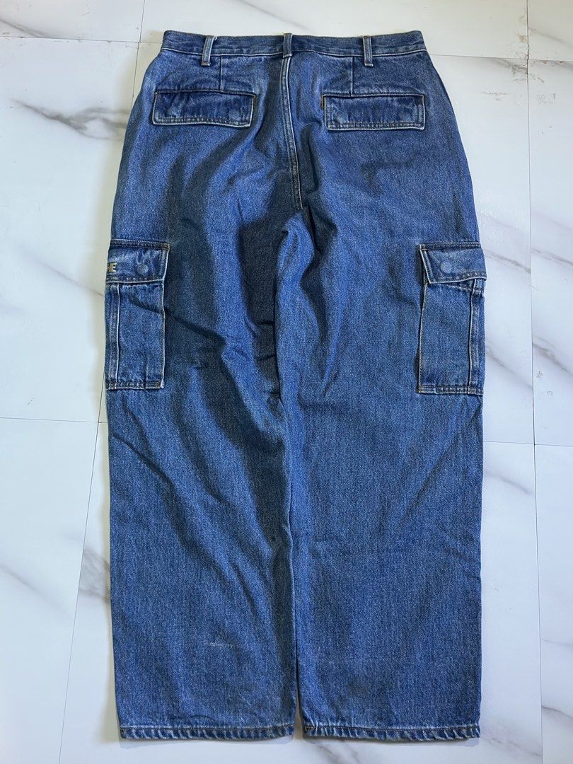XLARGE Denim Cargo Pants Size 32 (Category: Jeans) located in Cavite. Submitted by remcadzzz (Listing ID 1469415113, Image 2). Description: - Brand: XLARGE - Item: Denim Cargo Pants - Color: Blue - Size: 32 Waist - Material: 100% Cotton (Made in China) - Fit: Relaxed fit with standard button and zipper fly - Details: Utility pockets on both legs with embroidered logo on the flap - Style: Essential streetwear piece, perfect for pairing with tees a