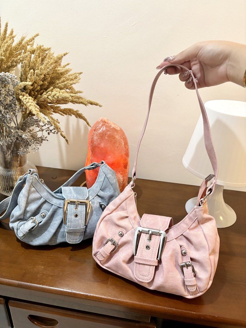 Y2K Buckle Denim Shoulder Bag Pink Blue (Category: Shoulder Bags) located in Binangonan. Submitted by blairmayie (Listing ID 1469444871, Image 3). Description: - Y2K style shoulder bag available in pink and light blue denim - Features trendy silver hardware, multiple decorative buckles, and stud accents - Secure top zipper closure with a structured slouchy shape - Comes with an adjustable shoulder strap for a custom fit - Available to purchase in