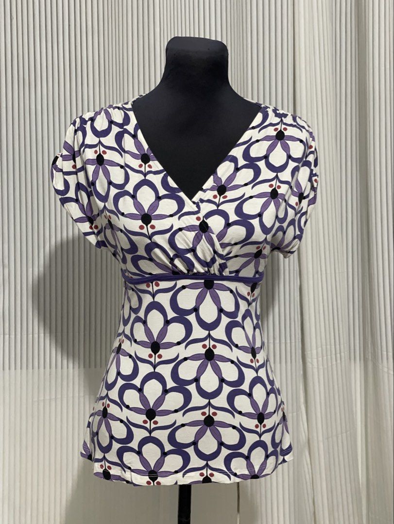 Y2K Dynamite White Purple Flower Design Top (Category: Shirts) located in Tuguegarao City. Submitted by ziggerryy (Listing ID 1469536263, Image 2). Description: No flaws. S-M but can still strech for semi L Cotton Stretch material Ruched shoulder design .