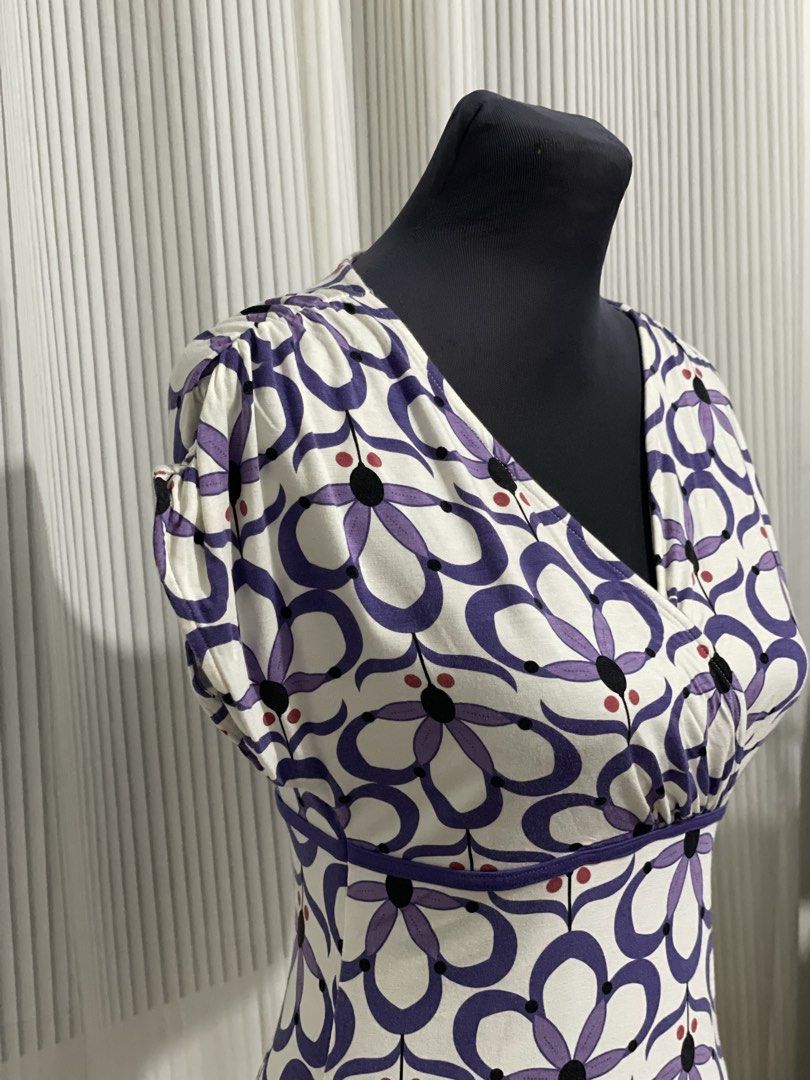Y2K Dynamite White Purple Flower Design Top (Category: Shirts) located in Tuguegarao City. Submitted by ziggerryy (Listing ID 1469536263, Image 3). Description: No flaws. S-M but can still strech for semi L Cotton Stretch material Ruched shoulder design .