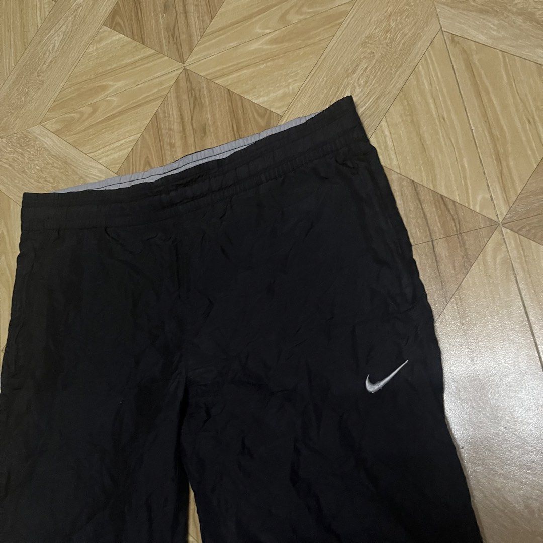 y2k nike trackpants (Category: Joggers) located in Cavite. Submitted by sacmaestro444 (Listing ID 1469524788, Image 3). Description: large on tag good condition issue logo not visible 9/10 colorate nego for sure buyer.