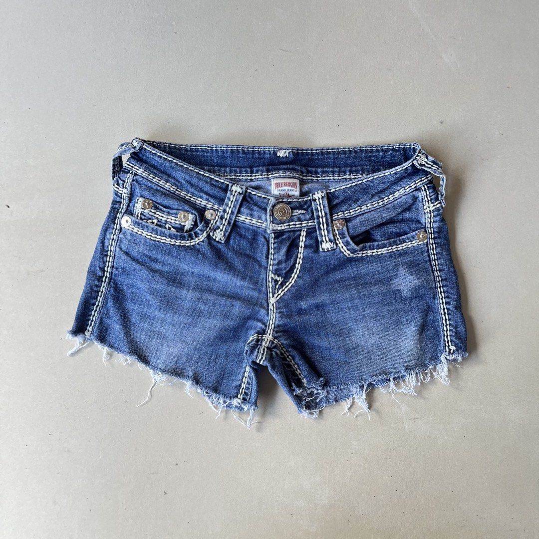 Y2k True Religion Denim Shorts (Category: Shorts) located in Mandaue City. Submitted by chinsyap_03 (Listing ID 1469468432, Image 3). Description: - Brand: True Religion - Style: Classic Y2K denim cutoffs - Wash: Medium blue - Waist: 26 inches - Length: 9 inches - Details: Signature thick white stitching, horseshoe back pockets, frayed raw hem, button fly, and back leather logo patch - Condition: Excellent pre-loved condition - Mode of Payment: G