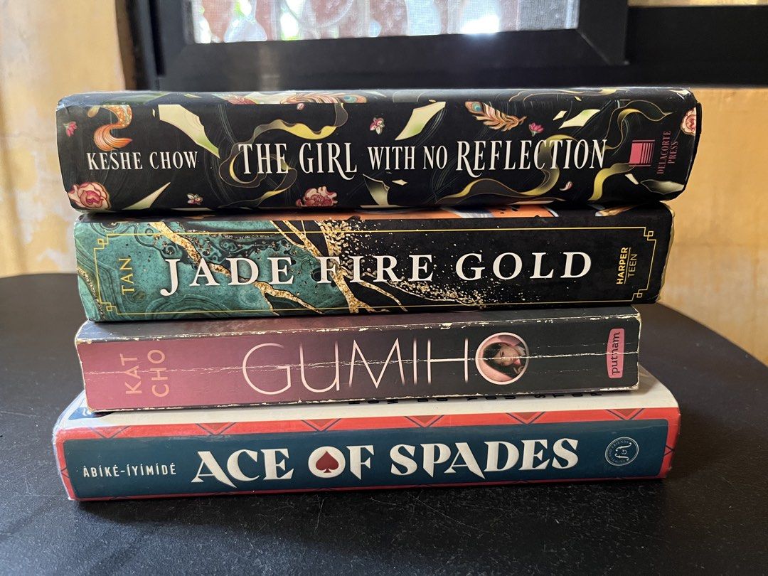 YA Fantasy Hardcover Novels Bundle Set (Category: Storybooks) located in Apalit. Submitted by uanngj27564 (Listing ID 1469495131, Image 1). Description: Decluttering preloved books for sale🩷 Condition: Readable in good condition but some books have foxing Paperback: Gumiho: Wicked Fox by Kat Cho - 150 Hardback: Jade Fire Gold by June C.L. Tan - 250 Ace of Spades - 150 *with foxing The Girl With No Reflection by Keshe Chow - 300 Buy as set: 700.0