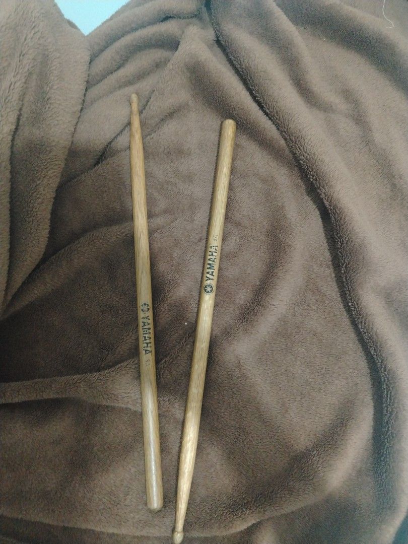 Yamaha 5A Drum Sticks Pair (Category: Musical Instruments) located in Manila. Submitted by oddcrystal-f71f (Listing ID 1469492163, Image 1). Description: - Authentic Yamaha 5A wood drum sticks - Standard size ideal for general drumming and practice pads - Features clear Yamaha logo on both sticks - Good overall condition with minimal wear on tips and shafts - Reliable choice for your drum kit.