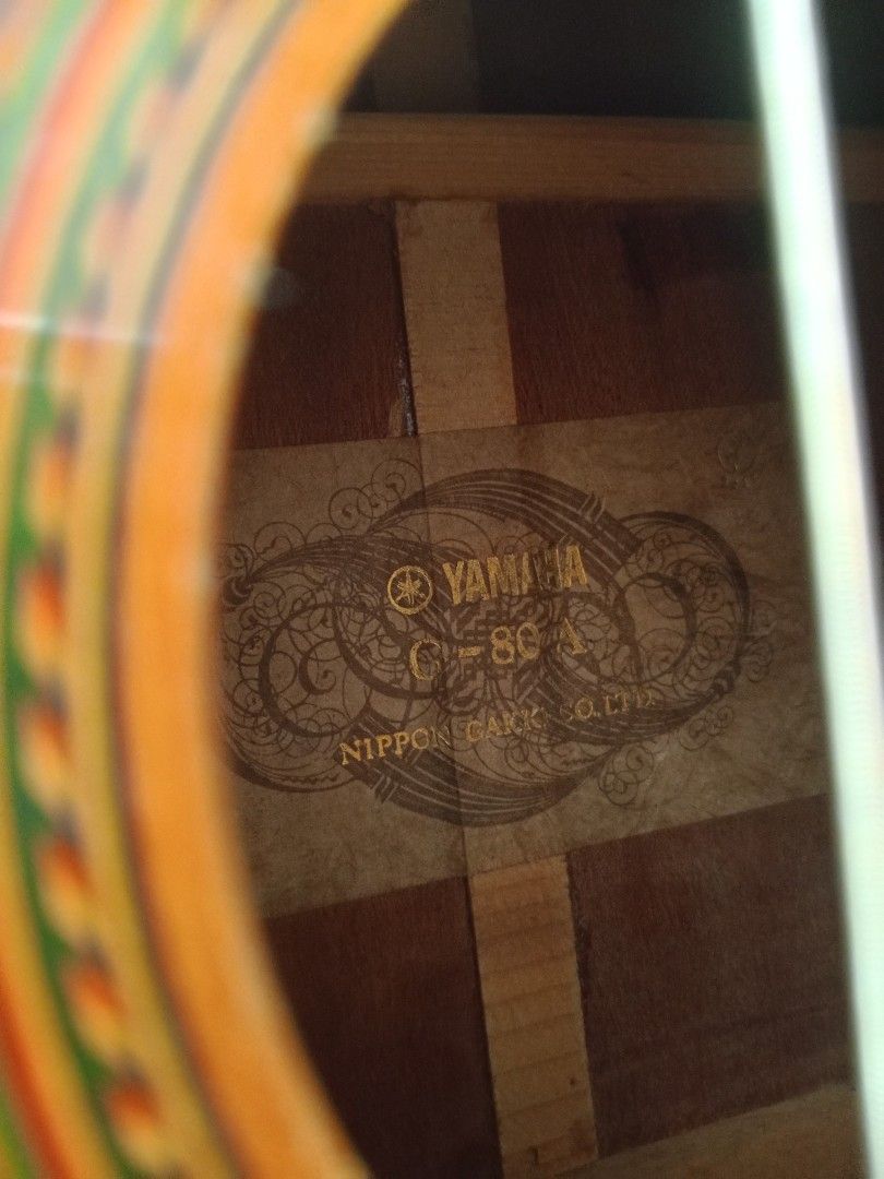 Yamaha C-80A Classical Guitar Nippon Gakki Co. Ltd. (Category: Musical Instruments) located in Manila. Submitted by papong89 (Listing ID 1469514515, Image 2). Description: - Model: Yamaha C-80A Classical Guitar (Vintage Nippon Gakki Co. Ltd. production) - Body: Standard classical shape with a classic natural wood finish and detailed soundhole rosette - Hardware: Nylon strings and traditional slotted headstock - Condition: Normal signs of handling
