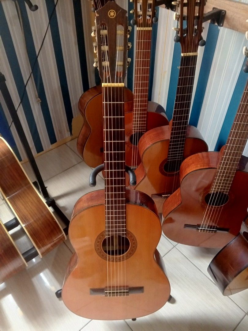Yamaha C-80A Classical Guitar Nippon Gakki Co. Ltd. (Category: Musical Instruments) located in Manila. Submitted by papong89 (Listing ID 1469514515, Image 1). Description: - Model: Yamaha C-80A Classical Guitar (Vintage Nippon Gakki Co. Ltd. production) - Body: Standard classical shape with a classic natural wood finish and detailed soundhole rosette - Hardware: Nylon strings and traditional slotted headstock - Condition: Normal signs of handling