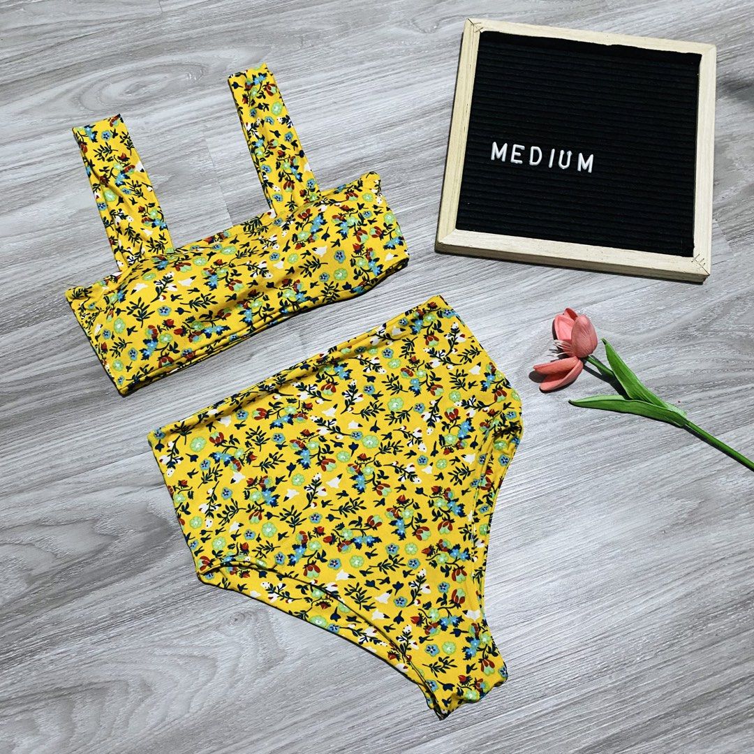 Yellow Floral Two-Piece Bikini (Category: Bikinis & Swimsuits) located in Caloocan City. Submitted by lovemyclothes21 (Listing ID 1469496747, Image 1). Description: - Style: Two-piece swimsuit with bandeau top and high-waisted bottoms - Design: Bright yellow with an all-over colorful tiny floral print - Features: Thick shoulder straps and good coverage - Size: Medium (as displayed in photo) - Perfect for: Beach days and pool parties.
