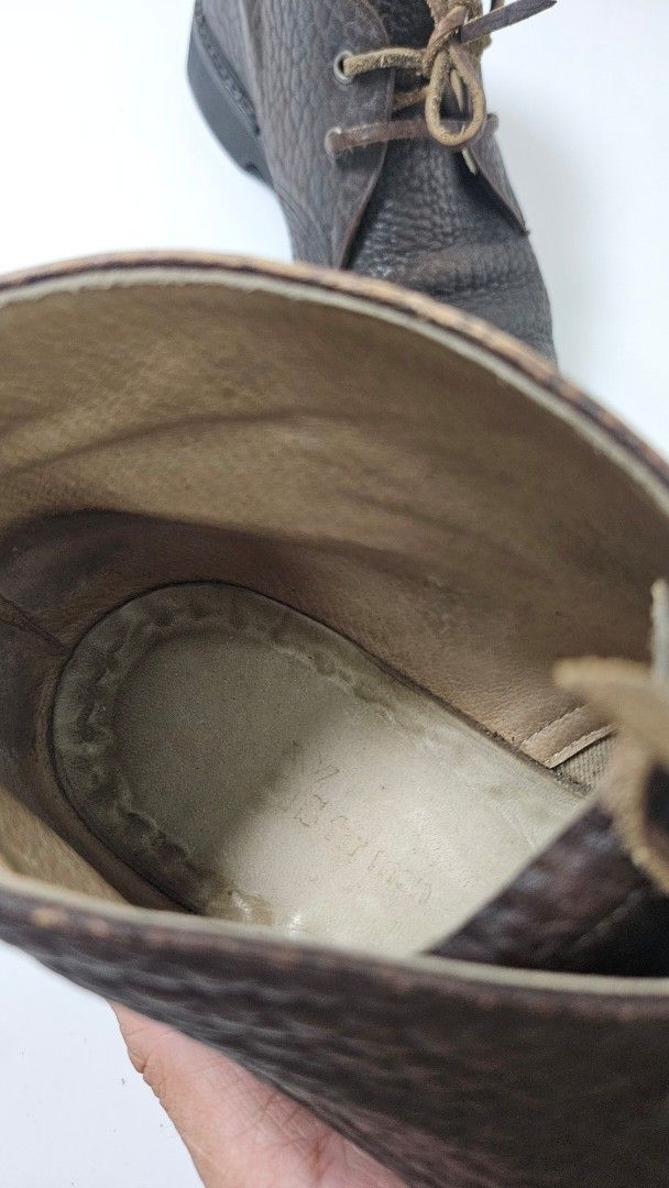 Yohji Yamamoto Leather Chukka Boots (Category: Boots) located in Alfonso. Submitted by jbcamet (Listing ID 1469515717, Image 3). Description: - Style: Classic dark brown textured leather chukka boots - Closure: Lace-up with thin leather laces - Interior: Comfortable cream lining - Soles: Durable black rubber with ribbed traction - Condition: Minimal wear on soles and uppers, excellent pre-loved condition - Versatility: Perfect for smart-casual an