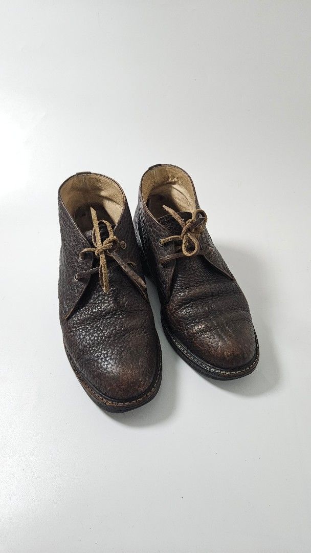 Yohji Yamamoto Leather Chukka Boots (Category: Boots) located in Alfonso. Submitted by jbcamet (Listing ID 1469515717, Image 2). Description: - Style: Classic dark brown textured leather chukka boots - Closure: Lace-up with thin leather laces - Interior: Comfortable cream lining - Soles: Durable black rubber with ribbed traction - Condition: Minimal wear on soles and uppers, excellent pre-loved condition - Versatility: Perfect for smart-casual an
