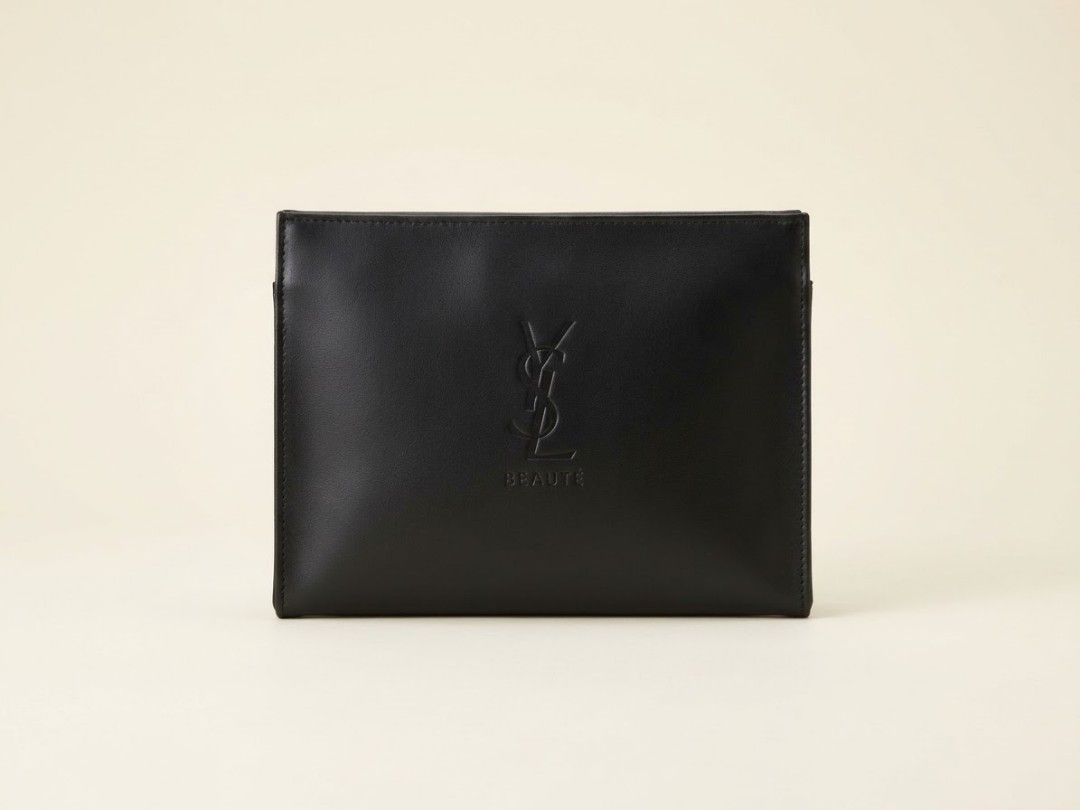 YSL Beauté flap pouch (Category: Luxury Bags & Wallets) located in Iba. Submitted by selector_items (Listing ID 1469544661, Image 1). Description: newest version - This is the *YSL Beauté flap pouch / clutch - the "Reduce Our Impact" edition* from 2023-2024 onwards: - *Front:* Flat envelope style with embossed *YSL + BEAUTÉ* logo, matte faux-leather (not the shiny vinyl of the older ones) - *Closure:* Two gold-tone snap buttons on the flap - you 