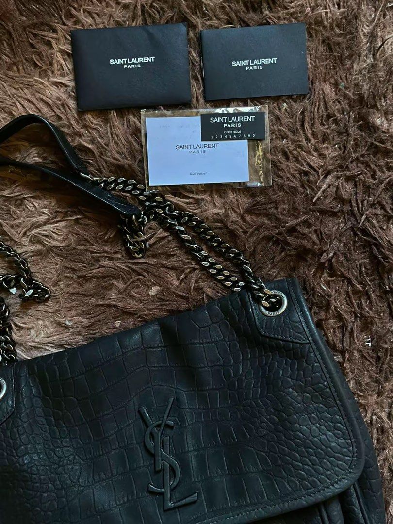 YSL NIKI MEDIUM CROC BLACK HW (Category: Cross-body Bags) located in Lingayen. Submitted by rizzaairtsua6 (Listing ID 1469404091, Image 2). Description: ✅Good condition, minor glazing wear on strap (see last photos)- otherwise no issues. ✅ Black hardware/ gunmetal chain ( can be worn double as shoulder bag or long cross body) ✅Size medium: fits phone, long wallet, small umbrella. .