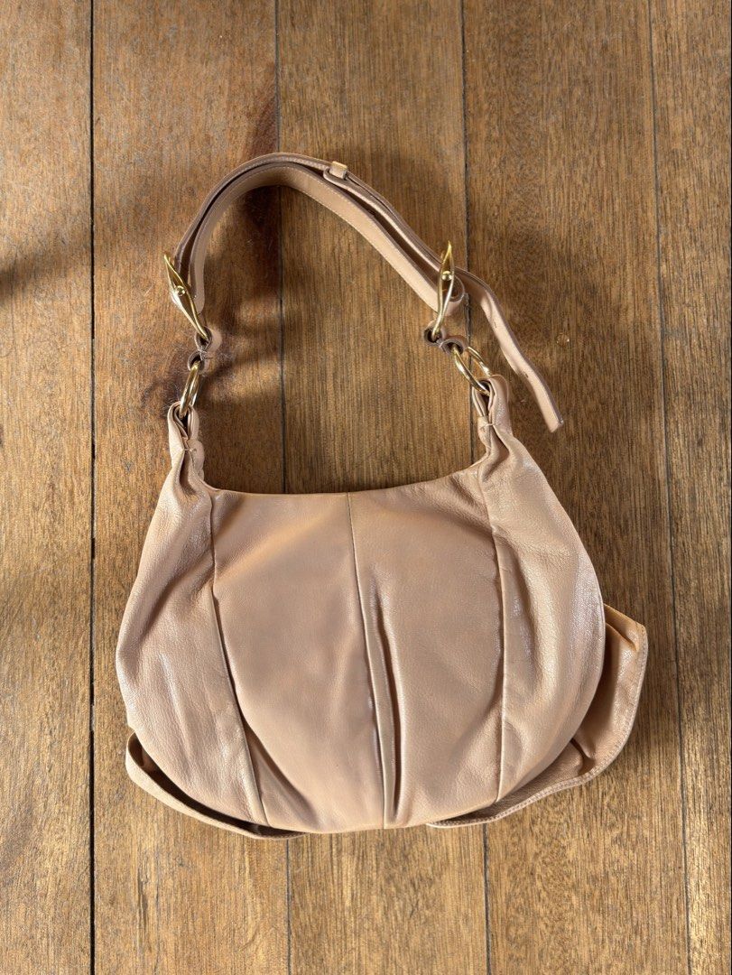 YSL Rive Nadja Rose Bag (Category: Luxury Bags & Wallets) located in Davao. Submitted by _iconculture (Listing ID 1469521870, Image 2). Description: AVAILABLE • YSL “Nadja” Rose Bag in Beige ★ A stunning archival piece from the Tom Ford era at Yves Saint Laurent, featured in the Spring/Summer 2003 collection. Condition: 9.5/10 — Excellent overall condition with minimal signs of use. Clean interior and buttery-soft leather. Inclusions: Original YS