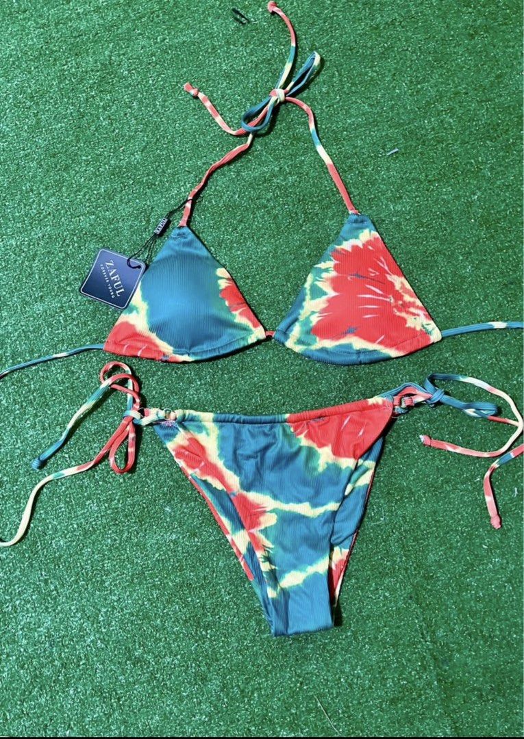 ZAFUL Tie-Dye Triangle Bikini Set (Category: Bikinis & Swimsuits) located in Bulacan. Submitted by lykaangel08 (Listing ID 1469553495, Image 1). Description: - RFS: Doesn’t fit - Brand: ZAFUL (Tag still attached, 100% unworn) - Style: Triangle top with halter neck ties and matching side-tie bottoms - Pattern/Color: Vibrant green, red, and yellow tie-dye - Material: Comfortable and trendy ribbed fabric.