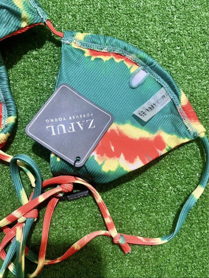 ZAFUL Tie-Dye Triangle Bikini Set (Category: Bikinis & Swimsuits) located in Bulacan. Submitted by lykaangel08 (Listing ID 1469553495, Image 2). Description: - RFS: Doesn’t fit - Brand: ZAFUL (Tag still attached, 100% unworn) - Style: Triangle top with halter neck ties and matching side-tie bottoms - Pattern/Color: Vibrant green, red, and yellow tie-dye - Material: Comfortable and trendy ribbed fabric.