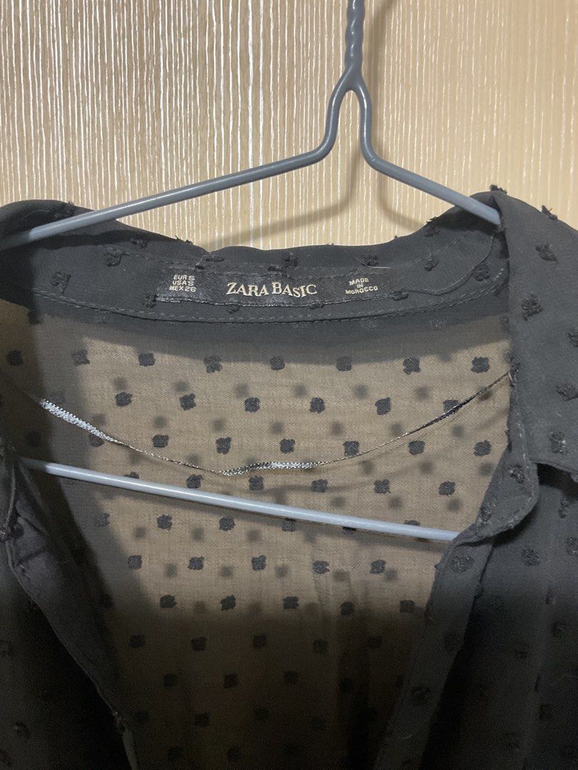 Zara Basic Black Dot Swiss Dress Size S (Category: Dresses) located in Quezon City. Submitted by patriciam.02 (Listing ID 1469496460, Image 3). Description: - Brand: Zara Basic - Size: S (Made in Morocco) - Color: Black with all-over textured dot pattern - Style: Midi dress, lightweight and flowy fabric - Details: V-neckline with 3 front buttons, stretchy smocked waist, and long sleeves with button cuffs.