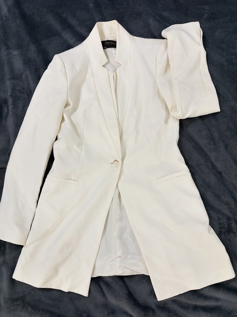 Zara Basic Collection Cream White Blazer Jacket Size S (Category: Coats, Jackets and Outerwear) located in Quezon City. Submitted by marifavo (Listing ID 1469446666, Image 1). Description: - Brand: Zara Basic Collection - Color: Cream White - Size: EUR S / USA S / MEX 26 - Design: Structured stand collar with single-button front closure - Pockets: Two front welt pockets - Lining: Fully lined interior - Origin: Made in Morocco - Condition: Excelle