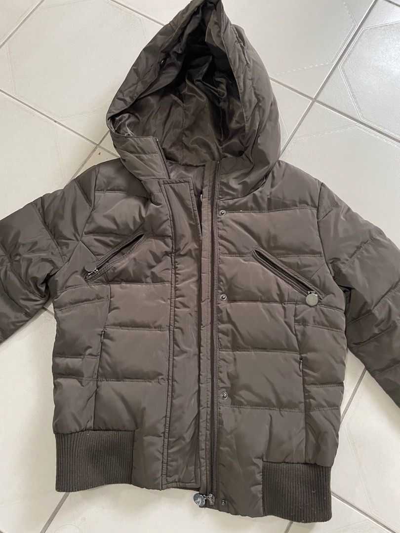 Zara Basic Down Jacket Brown Medium (Category: Coats, Jackets and Outerwear) located in Singapore. Submitted by calla_lala (Listing ID 1469475532, Image 2). Description: - Brand: Zara Basic - Style: Down jacket - Color: Brown with dark brown lining - Size: EUR M / USA M / MEX 28 - Features: Built-in hood, front zipper with snap buttons, angled zippered chest pockets, ribbed hem and cuffs - Origin: Made in China.