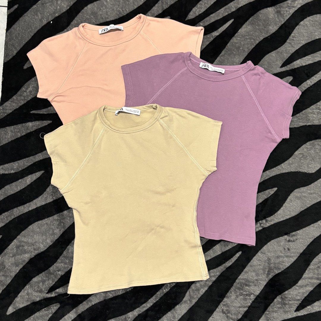 Zara basic ribbed top bundle (Category: Shirts) located in Caloocan City. Submitted by declutter.cal (Listing ID 1469542536, Image 2). Description: Xs-s Like new Take all 280 Basic ribbed - pink, purple, beige Polo cropped - black.