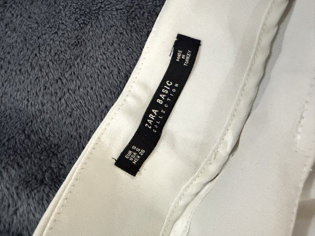Zara Basic White Culottes Size S (Category: Shorts) located in Quezon City. Submitted by marifavo (Listing ID 1469446527, Image 2). Description: - Brand: Zara Basic - Size: S (EUR S, USA S, MEX 26) - Made in Turkey - Color: Clean White - Material: Lightweight fabric - Design: Wrap-style front panel with tie belt detail and wide-leg cut - Condition: Great versatile staple piece for everyday wear.