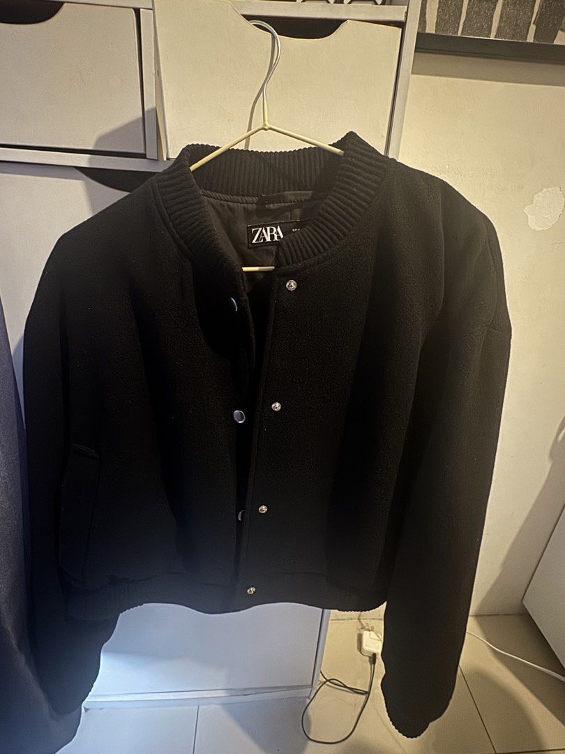 Zara Black Bomber Jacket Size XL (Category: Coats, Jackets and Outerwear) located in Makati City. Submitted by kpmg111 (Listing ID 1469478978, Image 1). Description: - Brand/Model: Zara Black Bomber Jacket - Size: XL - Color: Deep black - Design: Classic varsity silhouette with snap button closure - Details: Ribbed collar and hem, heavy fabric with inner lining - Condition/Use: Great layering piece for colder days.
