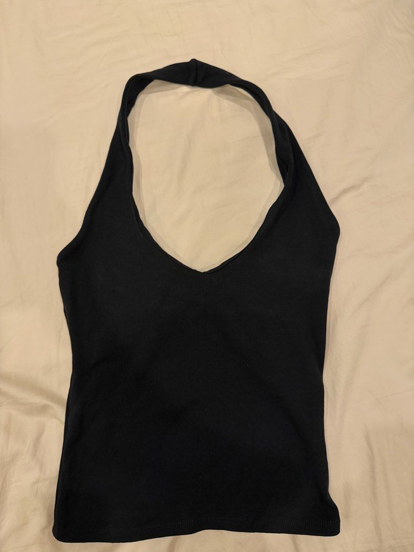 Zara Black ribbed halter neck top (Category: Sleeveless) located in Manila. Submitted by pinkyclothes1267 (Listing ID 1469482775, Image 1). Description: - Color: Black - Style: Ribbed halter top with V-neckline (front and back) - Size: S - Material: Stretchy, super comfortable fabric - Origin: Made in Bangladesh - Condition: Great versatile basic for casual days or going out.