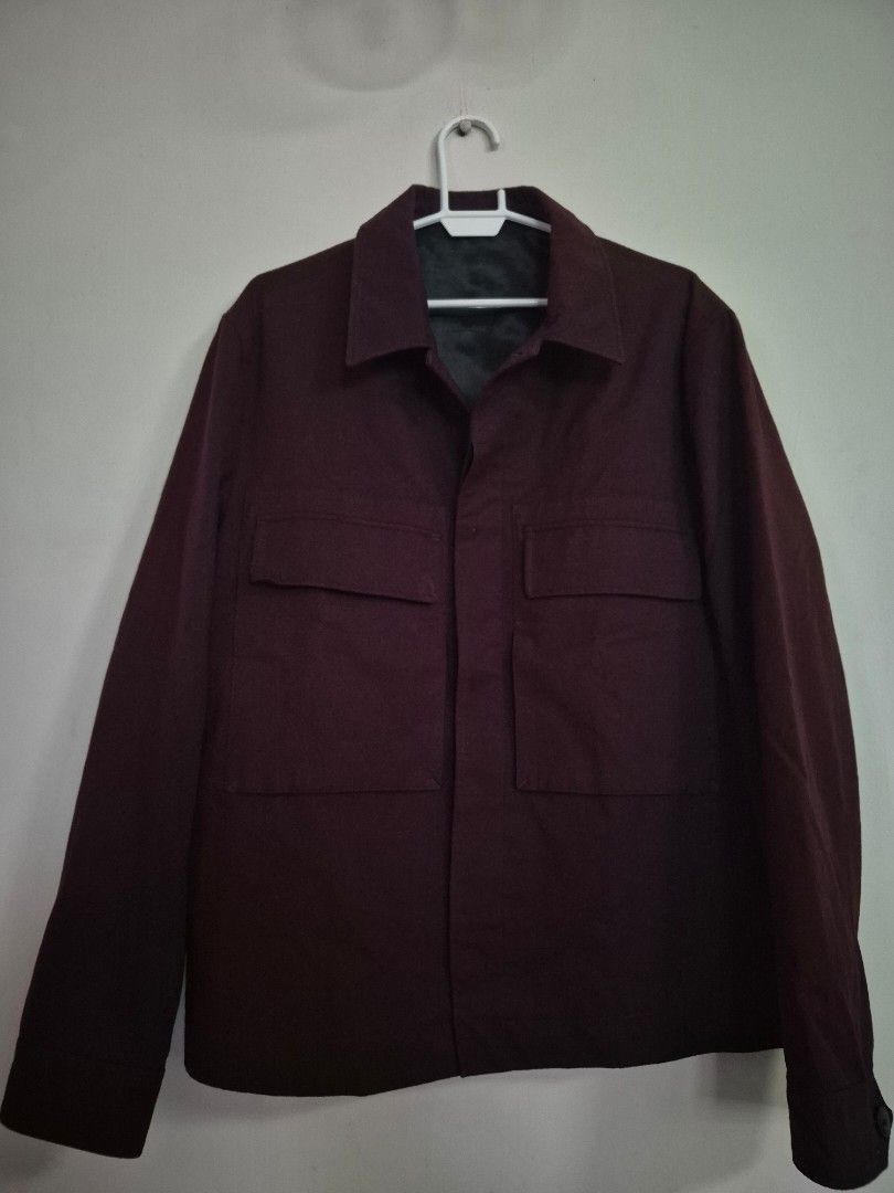Zara Burgundy Overshirt Jacket Size XL (Category: Coats, Jackets and Outerwear) located in Paranaque City. Submitted by monicaboo (Listing ID 1469409143, Image 1). Description: - Brand: Zara - Color: Burgundy - Size: XL - Origin: Made in Morocco - Material: Heavy textured fabric with dark inner lining - Closure: Button-up front - Features: Collared neckline, dual chest flap pockets, long sleeves with button cuffs.