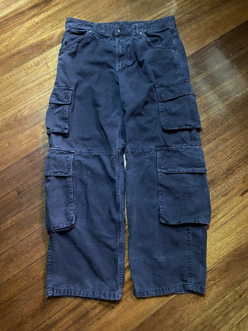 Zara Cargo Pants Size USA 34 Dark Grey (Category: Jeans) located in Baguio. Submitted by cs_studio248 (Listing ID 1469460981, Image 1). Description: - Brand: Zara - Size: USA 34 - Color: Dark grey with natural fading - Material: Heavy cotton twill (Made in Bangladesh) - Fit: Relaxed, baggy fit through thighs and calves - Waist: Mid-rise with button closure and belt loops - Pockets: Multiple utility pockets on both legs.