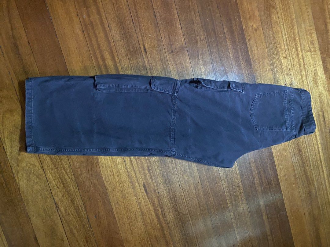 Zara Cargo Pants Size USA 34 Dark Grey (Category: Jeans) located in Baguio. Submitted by cs_studio248 (Listing ID 1469460981, Image 2). Description: - Brand: Zara - Size: USA 34 - Color: Dark grey with natural fading - Material: Heavy cotton twill (Made in Bangladesh) - Fit: Relaxed, baggy fit through thighs and calves - Waist: Mid-rise with button closure and belt loops - Pockets: Multiple utility pockets on both legs.