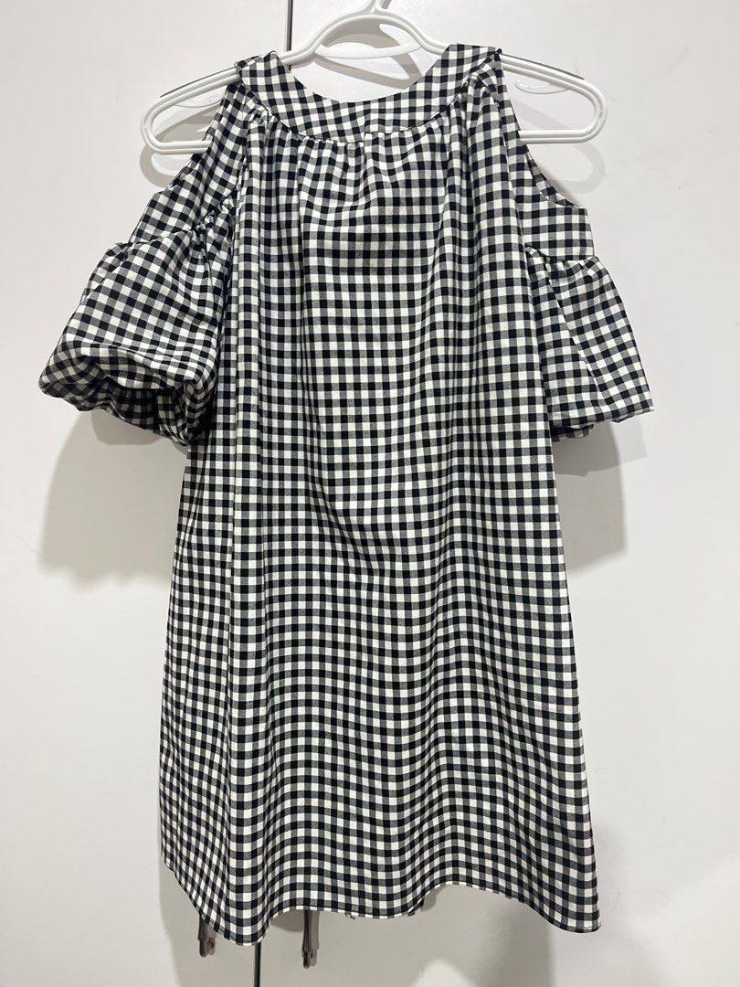 Zara Gingham Cold Shoulder Dress (Category: Dresses) located in Marikina City. Submitted by charmhazel_ (Listing ID 1469407285, Image 2). Description: - Pattern: Classic black and white gingham - Style: Cold shoulder with short puff sleeves - Neckline: High neckline with gathered details - Closure: Cute back tie closure - Fit: Loose, flowy, and easy to throw on - 550 + sf.