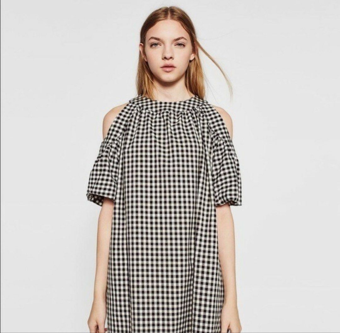 Zara Gingham Cold Shoulder Dress (Category: Dresses) located in Marikina City. Submitted by charmhazel_ (Listing ID 1469407285, Image 1). Description: - Pattern: Classic black and white gingham - Style: Cold shoulder with short puff sleeves - Neckline: High neckline with gathered details - Closure: Cute back tie closure - Fit: Loose, flowy, and easy to throw on - 550 + sf.