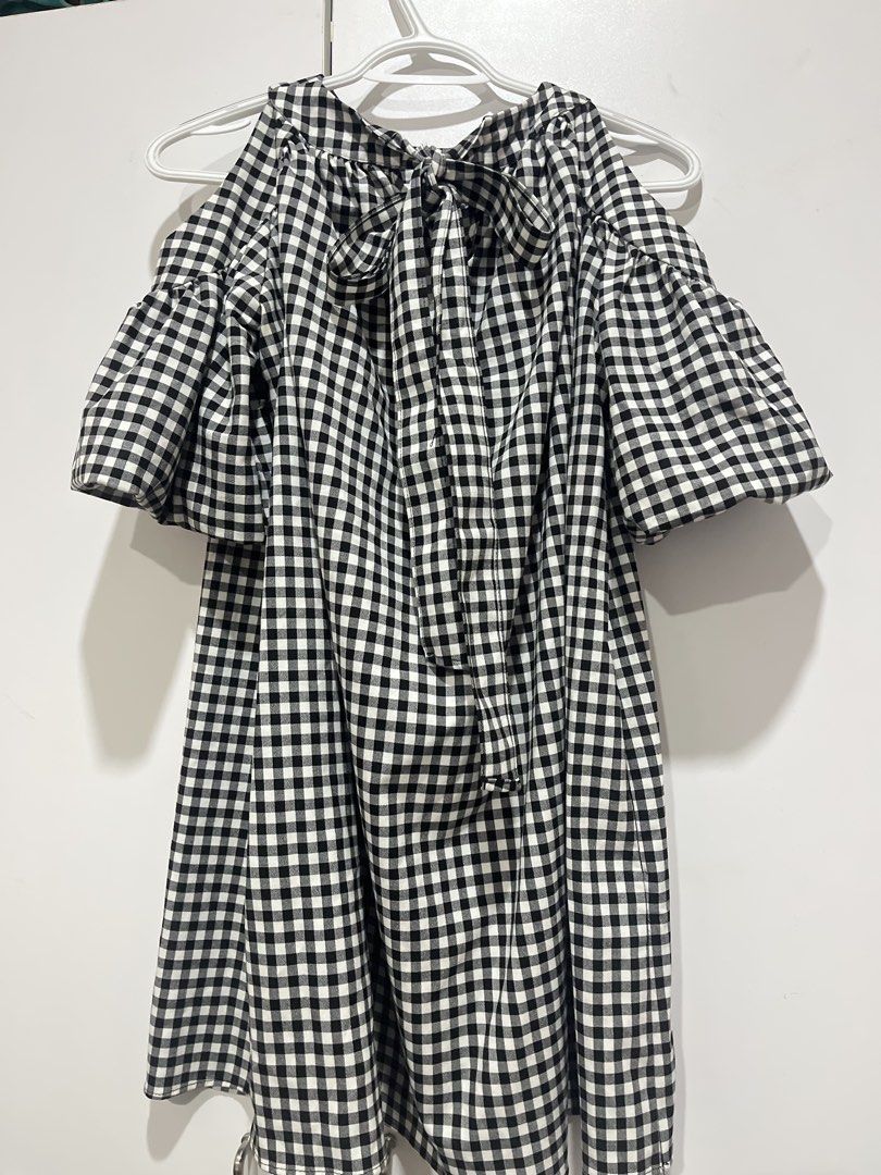 Zara Gingham Cold Shoulder Dress (Category: Dresses) located in Marikina City. Submitted by charmhazel_ (Listing ID 1469407285, Image 3). Description: - Pattern: Classic black and white gingham - Style: Cold shoulder with short puff sleeves - Neckline: High neckline with gathered details - Closure: Cute back tie closure - Fit: Loose, flowy, and easy to throw on - 550 + sf.