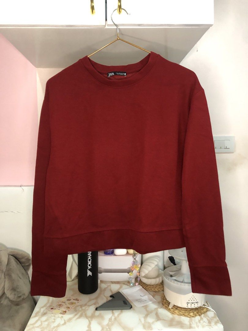 Zara Maroon Red Ribbed Sweatshirt Size S (Category: Coats, Jackets and Outerwear) located in Cauayan City . Submitted by wholly.craaaft (Listing ID 1469535758, Image 1). Description: - Brand: Zara - Color: Deep maroon red - Size: Small (S) - Made in Morocco - Material: Ribbed knit texture - Design: Classic crew neckline and long sleeves - Condition: Excellent, clean interior collar tag - Style: Easy to pair with jeans or joggers.