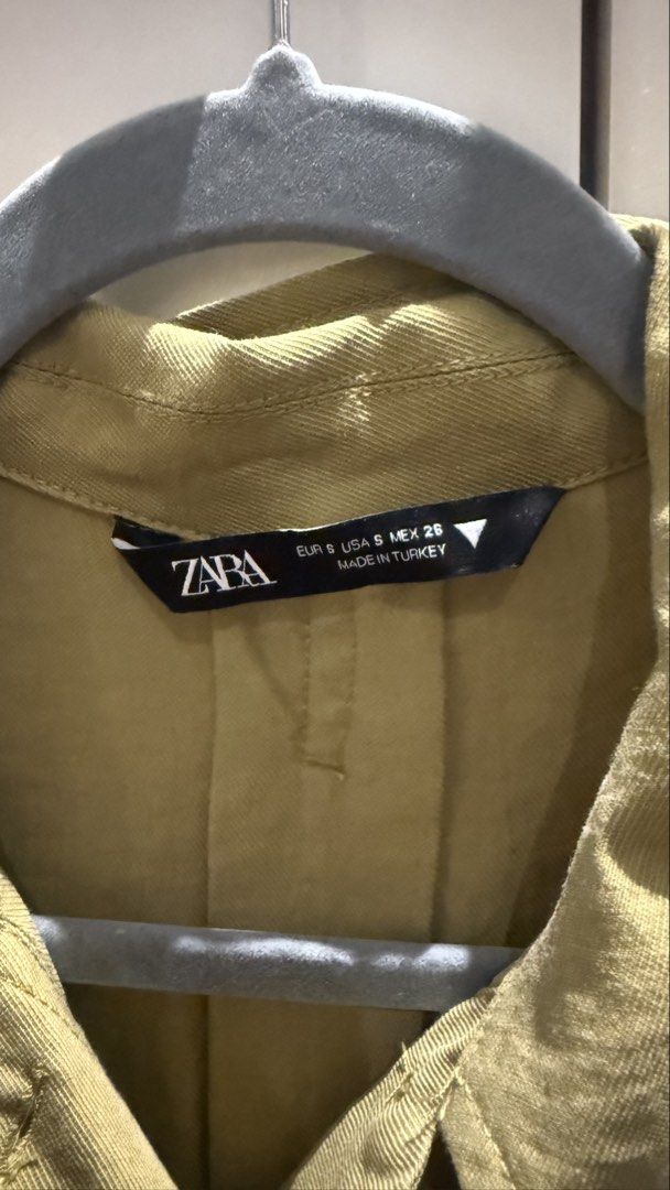 Zara Olive Green Collared Romper Size S (Category: Rompers) located in Paranaque City. Submitted by secondstories_ (Listing ID 1469479528, Image 2). Description: - Brand: Zara - Style: Collared romper with front button placket - Color: Olive green - Size: EUR S, USA S, MEX 26 - Features: Short sleeves, elasticated waist for a comfortable fit - Origin: Made in Turkey - Material: Lightweight, ideal for casual sunny days.