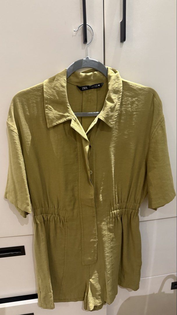 Zara Olive Green Collared Romper Size S (Category: Rompers) located in Paranaque City. Submitted by secondstories_ (Listing ID 1469479528, Image 1). Description: - Brand: Zara - Style: Collared romper with front button placket - Color: Olive green - Size: EUR S, USA S, MEX 26 - Features: Short sleeves, elasticated waist for a comfortable fit - Origin: Made in Turkey - Material: Lightweight, ideal for casual sunny days.