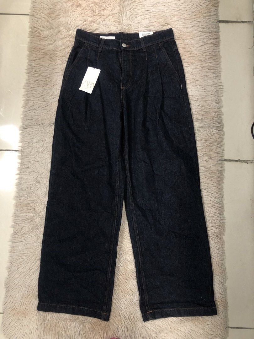 ZARA Wide Pleated Dark Denim Jeans (Category: Jeans) located in Angeles City. Submitted by maryannsantos (Listing ID 1469466735, Image 1). Description: - Brand: ZARA - Condition: Brand new with original tags, never worn - Style: Relaxed slouchy fit with pleated front and high-rise waist - Wash: Dark wash with classic contrast stitching - Details: Zipper fly, button closure, and classic five-pocket design - Size: EUR 40 / USA 31 / MEX 31.