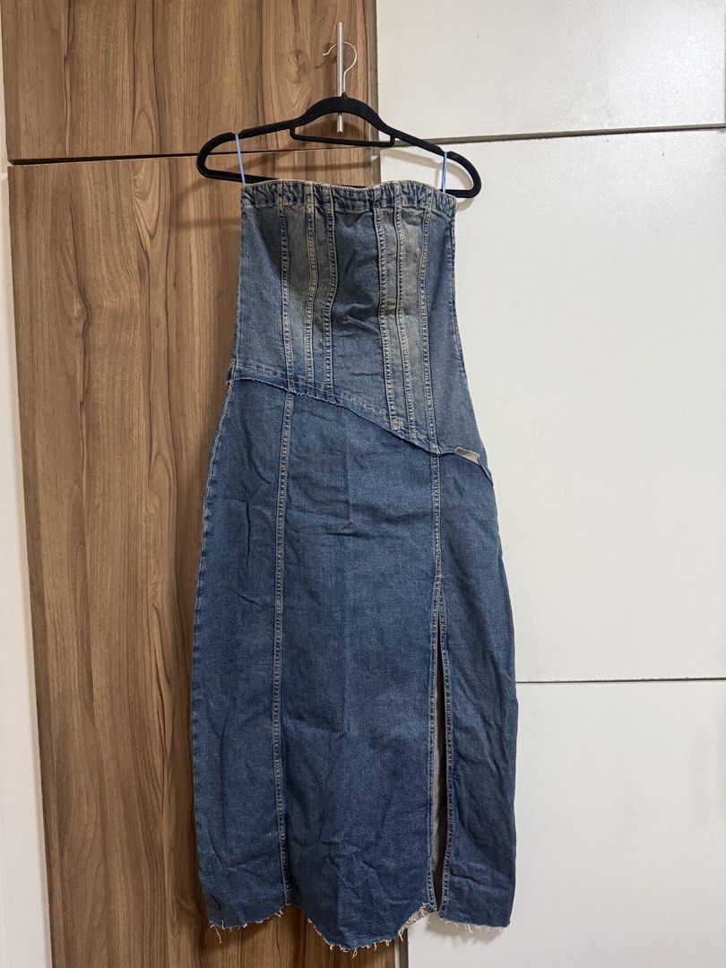 Zara TRF Strapless Denim Dress (Category: Dresses) located in Binangonan. Submitted by curatedbyjuys (Listing ID 1469443207, Image 2). Description: - Brand: Zara TRF - Style: Strapless denim midi dress with asymmetrical front seam and raw hem with front slit - Color/Wash: Dark blue - Size: S (EUR S, USA S) - Details: Fitted corset bodice detailing and smocked back panel - Condition: Brand new with original tags attached (Retail €49.95) - Origin: 
