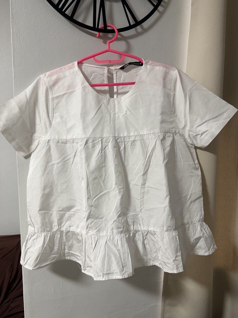 Zara White Tie-Back Peplum Blouse (Category: Blouses) located in Mandaluyong City. Submitted by blzstr (Listing ID 1469435832, Image 3). Description: PHOTOS FOR REFERENCE ONLY - Flowy babydoll short sleeve blouse with tiered ruffles - Cute ribbon tie-back closure at the upper back - Size: S (Made in Morocco) WITH STAIN ISSUE (not sure if washable, haven’t tried yet, nastock na).