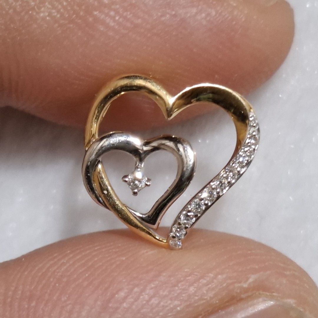 18k Diamond Pendant (Category: Necklaces) located in Manila. Submitted by treasurechest888 (Listing ID 1469652838, Image 1). Description: Preowned 18k gold diamond heart pendant (.06ct, 1.20 grams). Pwede COD or COP ng LBC with 1,000 pesos downpayment..