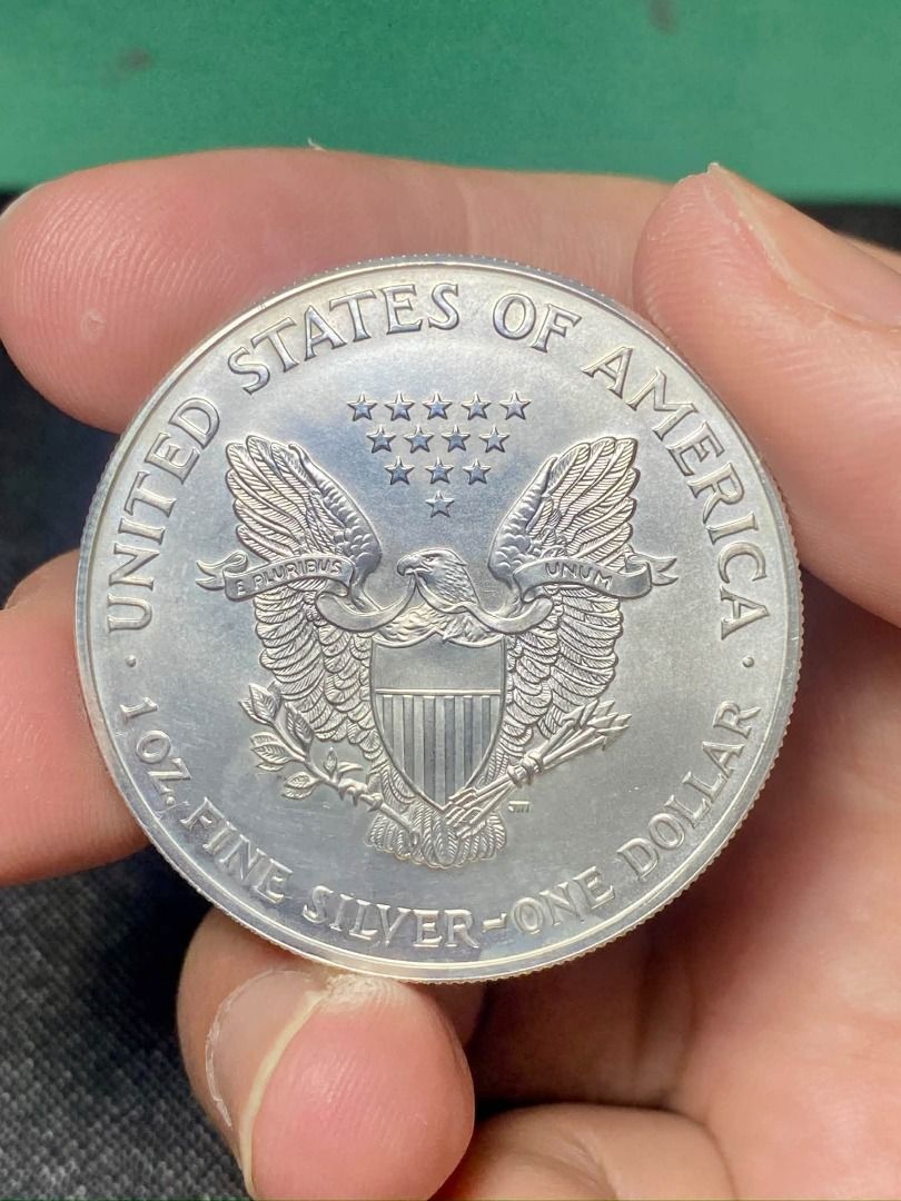 1999 Colorized American Silver Eagle 1oz Silver Coin (Category: Currency) located in Quezon City. Submitted by adonbilibit (Listing ID 1469608891, Image 1). Description: - 1999 American Silver Eagle collectible coin - Hand-painted color details showcasing Lady Liberty, the US flag, and oak branches - Features a vibrant sunrise design and 'IN GOD WE TRUST' stamp - Classic reeded edge texture along the silver rim - Note: Minor fingerprints visible 