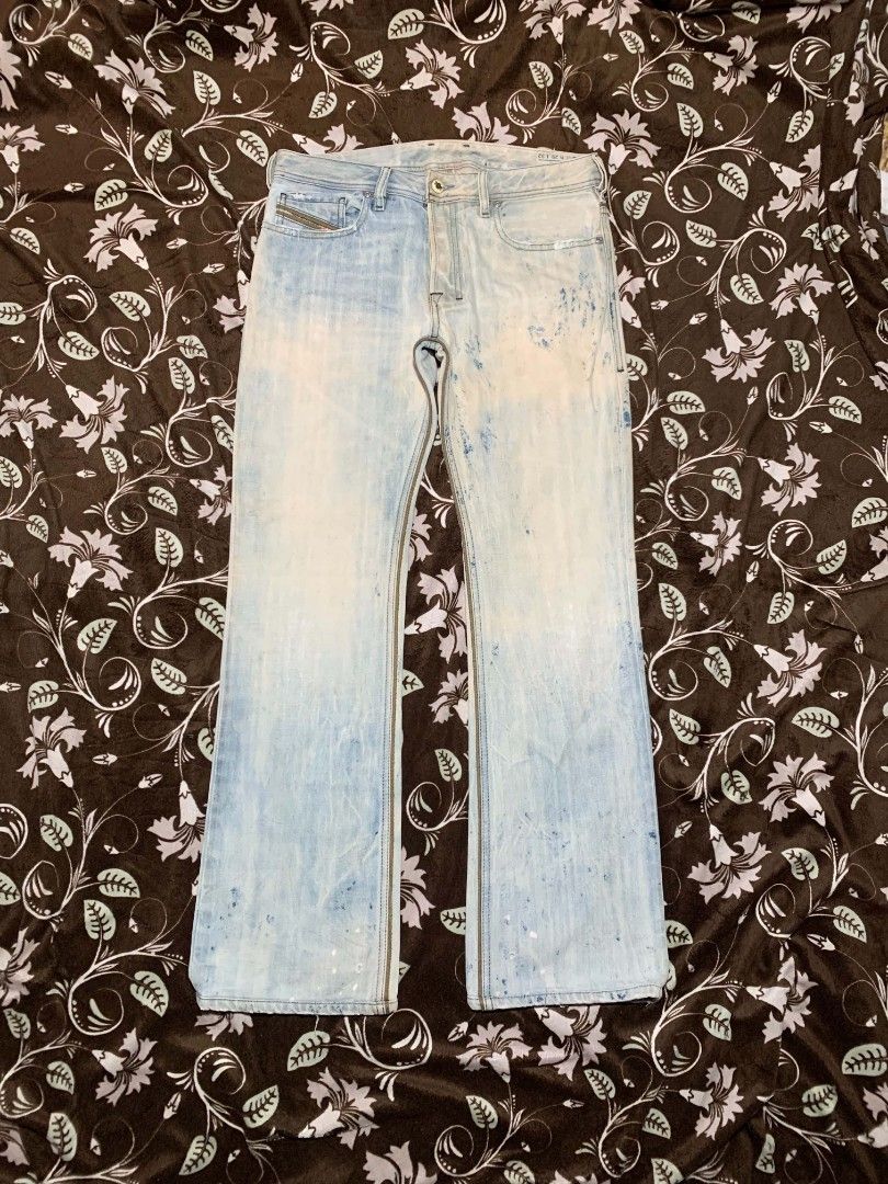2000s DIESEL Zatiny Paint Splatter Bootcut Jeans (Category: Jeans) located in Bislig. Submitted by rndm_stff1 (Listing ID 1469607103, Image 1). Description: Rare archival Y2K bootcut jeans from Diesel (Model: Zatiny, Wash: 008GR. Features a heavily treated light bleach wash with artistic blue paint splatter effects, button fly, and signature Diesel pocket detailing. A highly collectible piece of early 2000s designer denim. Details: - Brand: DIESE