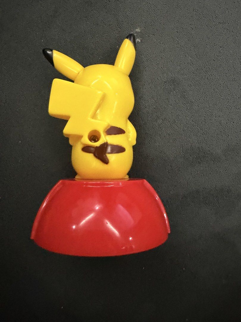 2012 Pikachu Figure Toy (Category: Character Goods) located in Lipa City. Submitted by cokelight11 (Listing ID 1469690752, Image 2). Description: - McDonald's Pikachu Figure - Release Year: 2012 - Authenticity: Nintendo, Pokémon, and McDonald's copyright stamps on the bottom - Condition: Minor scuffs from handling and play; wheels roll smoothly - Perfect for Pokémon collectors and franchise fans.